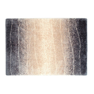 どんなお部屋の床にも溶け込むベージュをメインカラーに、 落ち着いたネイビーのグラデーションがお部屋に程よいアクセントを与えてくれるラグ。