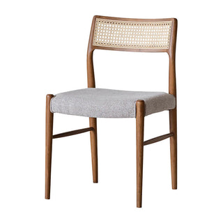 曲線を帯びた木フレームに、ラタンの背もたれとファブリックの座面がマッチしたチェア